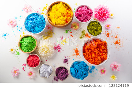 Happy Holi decoration, the indian festival.Top view of colorful holi powder and flower on white background. Happy Holi decoration, the indian festival.Top view of colorful holi powder and flower on white background. 122124119