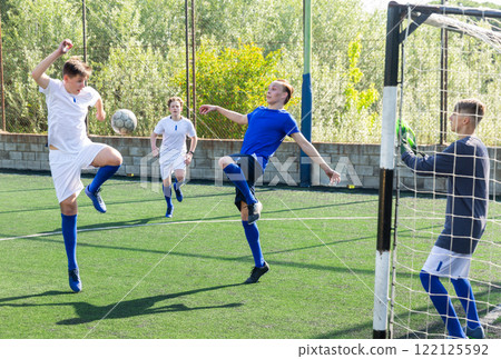 Young football players fighting for ball Young football players fighting for ball 122125592