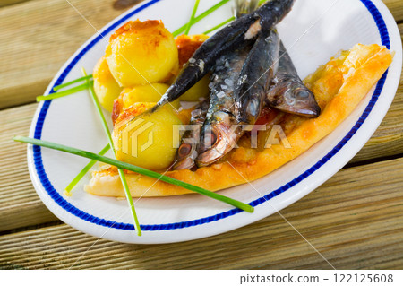Roasted sardines with focaccia and potato croquettes Roasted sardines with focaccia and potato croquettes 122125608