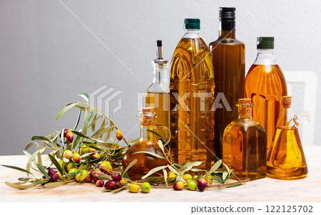 Bottles and carafes with olive oil Bottles and carafes with olive oil 122125702