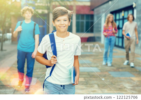 Portrait of teenager boy going to school lessons on summer day 122125706