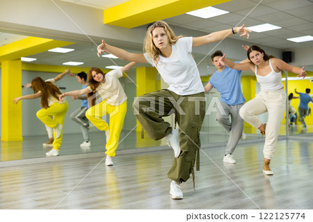 Teen girl in wide pants dancing hip hop 122125774