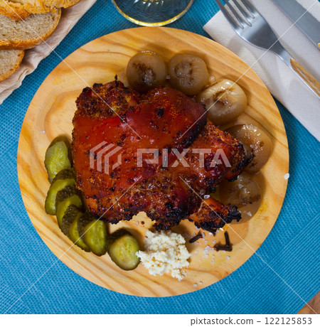 Roast pork knuckle with vegetables 122125853