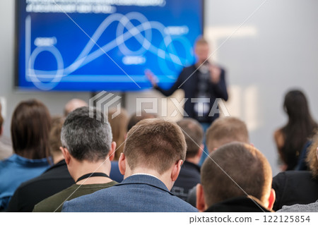 Conference audience attentively listening to business presentation by speaker 122125854