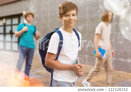 Teenager boy going to school lessons 122126152