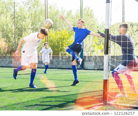 Young football players fighting for ball Young football players fighting for ball 122126257