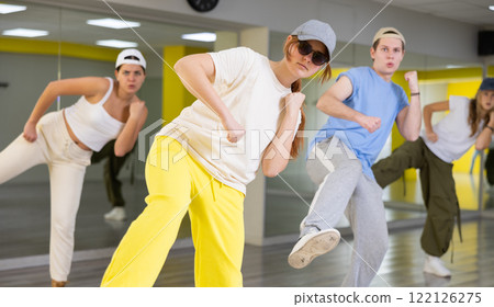 Young girl training breakdance Footwork moves in dance hall 122126275