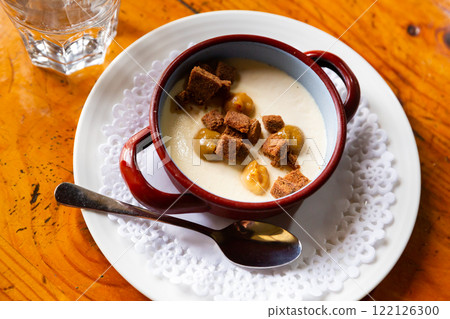 Custard dessert with cream cheese, brownie, praline Custard dessert with cream cheese, brownie, praline 122126300