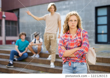 Sad girl quarreled with boys Sad girl quarreled with boys 122126313