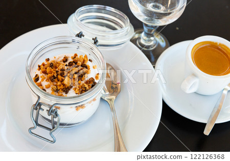 Tiramisu traditional italian dessert, garnished with cookies Tiramisu traditional italian dessert, garnished with cookies 122126368