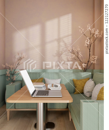 A laptop placed on a wooden table in modern pastel cafe or office lounge. 122127270