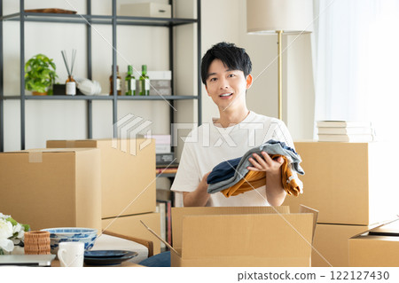 young man moving young man moving 122127430