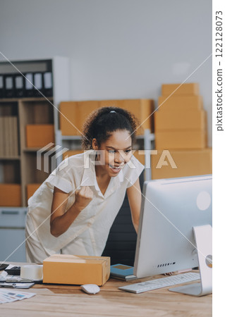 Portrait of Starting small businesses SME owners female entrepreneurs working on receipt box and check online orders to prepare to pack the boxes, sell to customers, SME business ideas online. 122128073