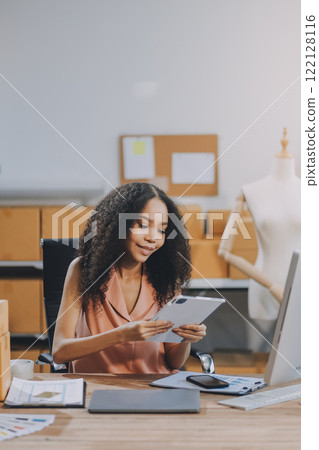 Portrait of Starting small businesses SME owners female entrepreneurs working on receipt box and check online orders to prepare to pack the boxes, sell to customers, SME business ideas online. 122128116