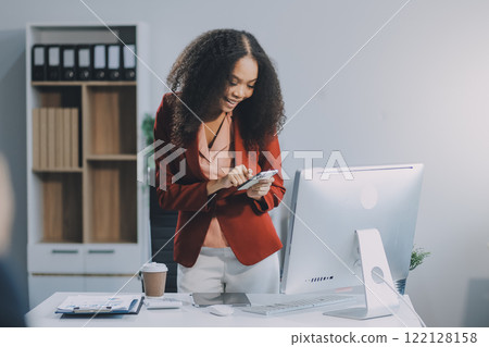 Excited african American woman sit at desk feel euphoric win online lottery, happy black woman overjoyed get mail at laptop being promoted at work, biracial girl amazed read good news at computer Excited african American woman sit at desk feel euphoric win online lottery, happy black woman overjoyed get mail at laptop being promoted at work, biracial girl amazed read good news at computer 122128158