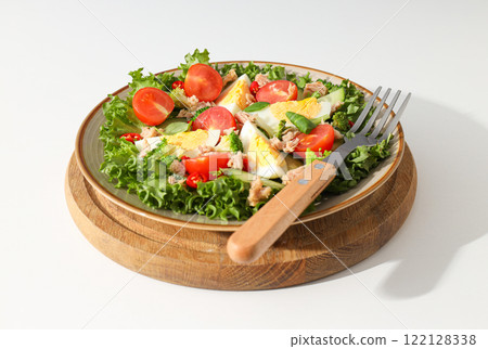 Ready salad with tuna on a wooden board. 122128338