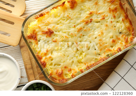 Concept of tasty and delicious homemade food - potato casserole Concept of tasty and delicious homemade food - potato casserole 122128360