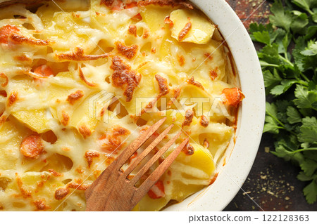 Concept of tasty and delicious homemade food - potato casserole Concept of tasty and delicious homemade food - potato casserole 122128363