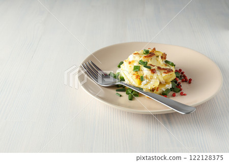 Concept of tasty and delicious homemade food - potato casserole Concept of tasty and delicious homemade food - potato casserole 122128375