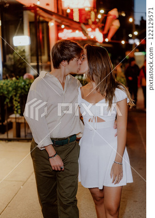 Enjoying a Romantic Evening Stroll in Comfortable and Casual Attire Under the Stars 122129571