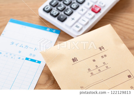 Time card, pay envelope and calculator Time card, pay envelope and calculator 122129813
