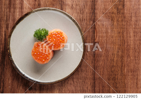 Salmon Roe Ikura Nigiri Sushi Served on a Plate Salmon Roe Ikura Nigiri Sushi Served on a Plate 122129905
