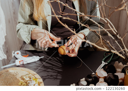 Tutorial How to make Easter table decoration with egg shells step by step instruction. Easter home decoration on wooden branch. Seasonal sustainable recycled 122130260