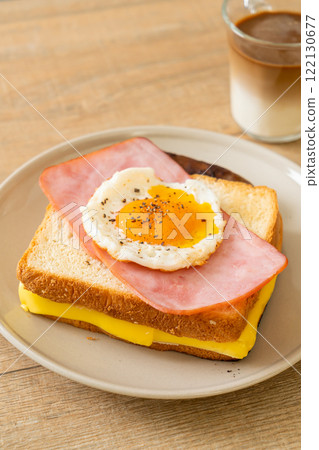 bread toasted cheese topped ham and fried egg with pork sausage bread toasted cheese topped ham and fried egg with pork sausage 122130677