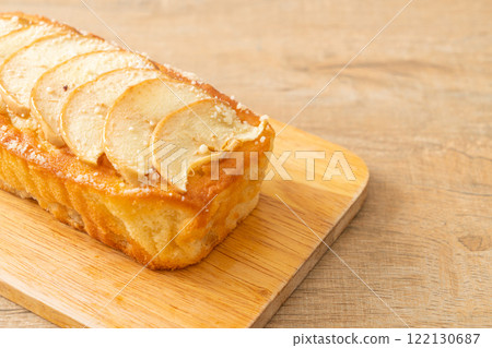 apple loaf crumbled on wood board 122130687