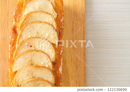 apple loaf crumbled on wood board apple loaf crumbled on wood board 122130690