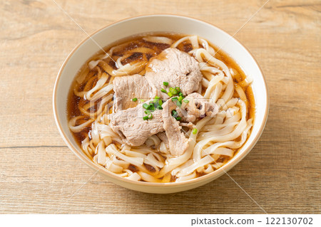 homemade udon noodles with pork in soy or shoyu soup 122130702