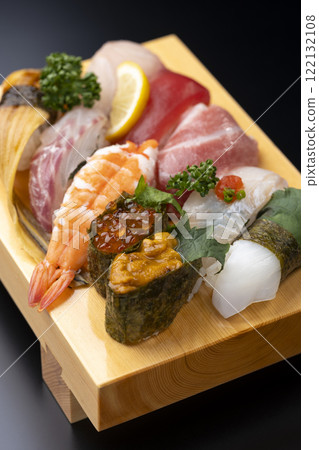 Close-up of a high-quality nigiri sushi set served on a sushi geta 122132108