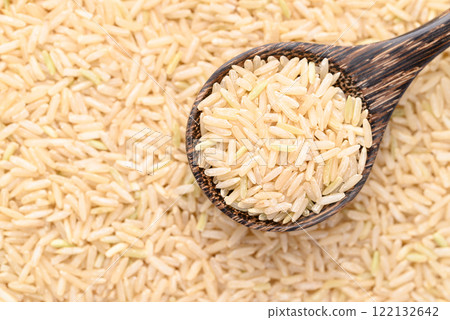Organic Jasmine brown rice seed in wooden spoon, Thai Rice Organic Jasmine brown rice seed in wooden spoon, Thai Rice 122132642