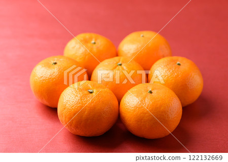 Mandarin tangerine orange fruit on red background, Lucky food in Lunar New Year or Chinese New Year 122132669