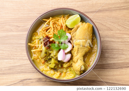 Northern Thai food (Khao Soi), Spicy curry noodles soup with chicken, Local Thai food Northern Thai food (Khao Soi), Spicy curry noodles soup with chicken, Local Thai food 122132690