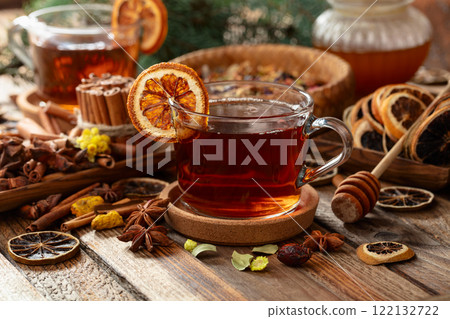Christmas herbal tea with ingredients on a old wooden table. 122132722