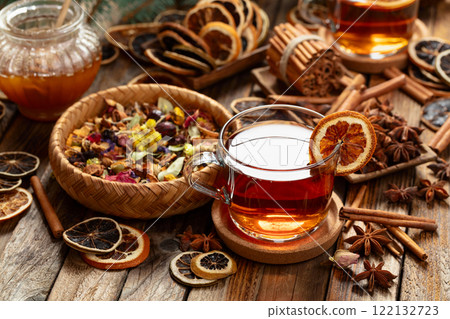 Christmas herbal tea with ingredients on a old wooden table. 122132723