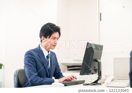 A businessman with a negative expression on his face because work is not going well A businessman with a negative expression on his face because work is not going well 122133045