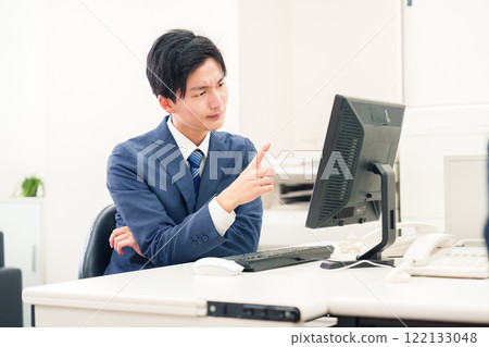 A businessman with a negative expression on his face because work is not going well A businessman with a negative expression on his face because work is not going well 122133048
