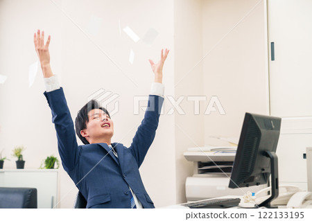 Businessman tearing up documents in the office 122133195