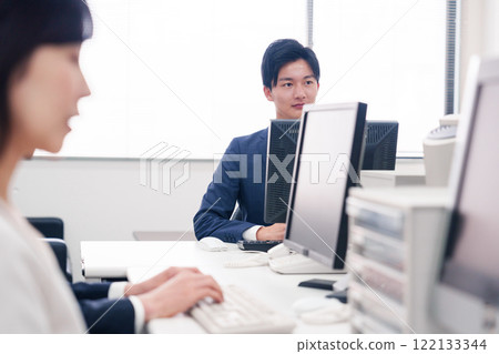 Multiple business people working in an office 122133344