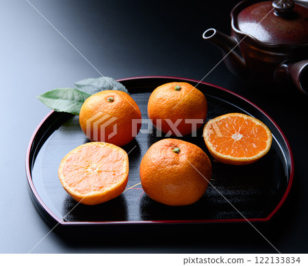 Tangerines on a tray (black background) Tangerines on a tray (black background) 122133834
