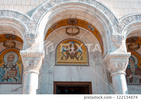 Belgrade, Serbia- 10162024: The Temple Of Saint Sava indoor interior, people pray in an Orthodox church, frescoes on the ceilings and walls of the church Belgrade, Serbia- 10162024: The Temple Of Saint Sava indoor interior, people pray in an Orthodox church, frescoes on the ceilings and walls of the church 122134874