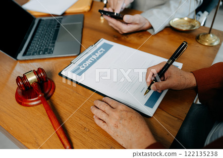 Businessman and Male lawyer or judge consult having team meeting with client, Law and Legal services concept in office. Businessman and Male lawyer or judge consult having team meeting with client, Law and Legal services concept in office. 122135238