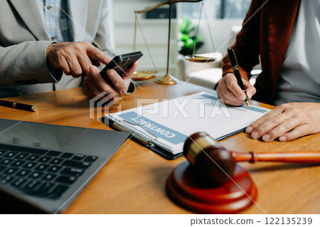 Businessman and Male lawyer or judge consult having team meeting with client, Law and Legal services concept in office. 122135239