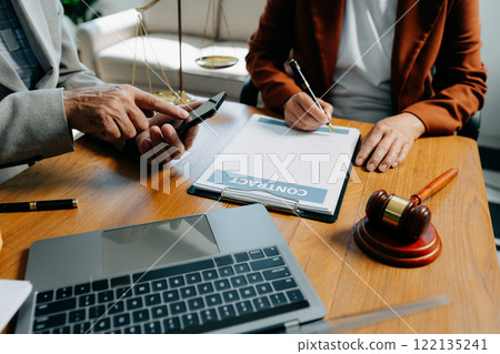 Businessman and Male lawyer or judge consult having team meeting with client, Law and Legal services concept in office. Businessman and Male lawyer or judge consult having team meeting with client, Law and Legal services concept in office. 122135241