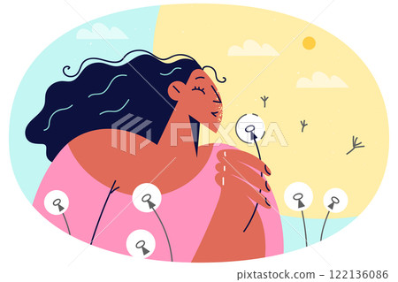 Smiling girl blow dandelion during summertime 122136086