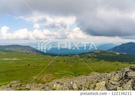Forests and mountains of the Southern Urals near the village of Tyulyuk in Russia. Drone view. Forests and mountains of the Southern Urals near the village of Tyulyuk in Russia. Drone view. 122136211