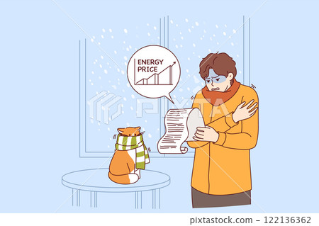 Rising prices for electricity cause stress for man studying bill, standing in cold apartment Rising prices for electricity cause stress for man studying bill, standing in cold apartment 122136362
