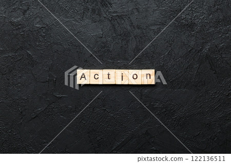 Action word written on wood block. Action text on table, concept Action word written on wood block. Action text on table, concept 122136511